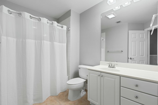 full bathroom featuring toilet, vanity, tile patterned floors, and shower / bath combo with shower curtain