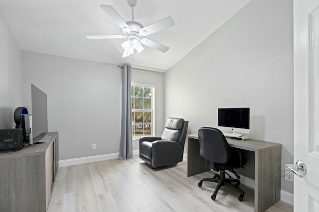 home office with ceiling fan, lofted ceiling, and light hardwood / wood-style flooring