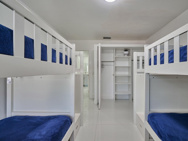 bedroom featuring light tile patterned floors