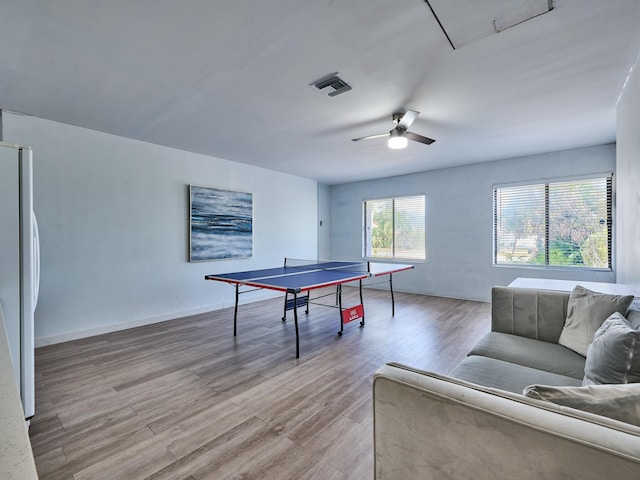 game room featuring light wood-type flooring and ceiling fan