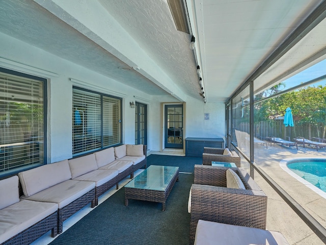 view of patio with outdoor lounge area and a fenced in pool