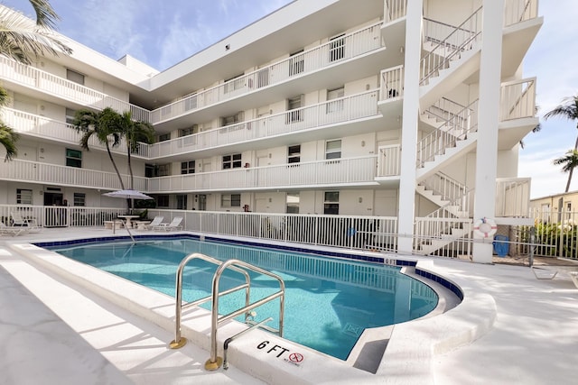 view of swimming pool featuring a patio