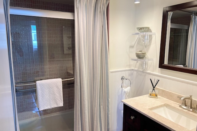 bathroom with vanity and shower / bath combo with shower curtain