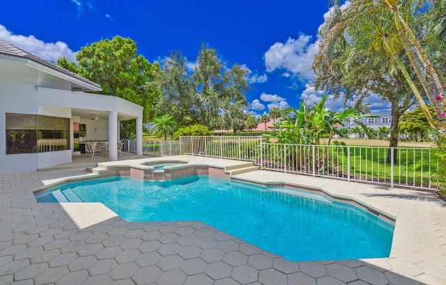 view of swimming pool with an in ground hot tub, a patio, and ceiling fan