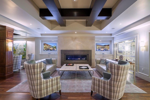 living room with beam ceiling, a fireplace, dark hardwood / wood-style floors, and coffered ceiling