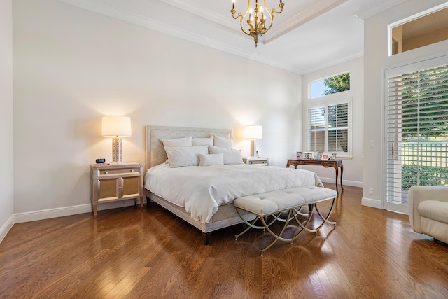 bedroom with a notable chandelier, crown molding, and dark hardwood / wood-style floors