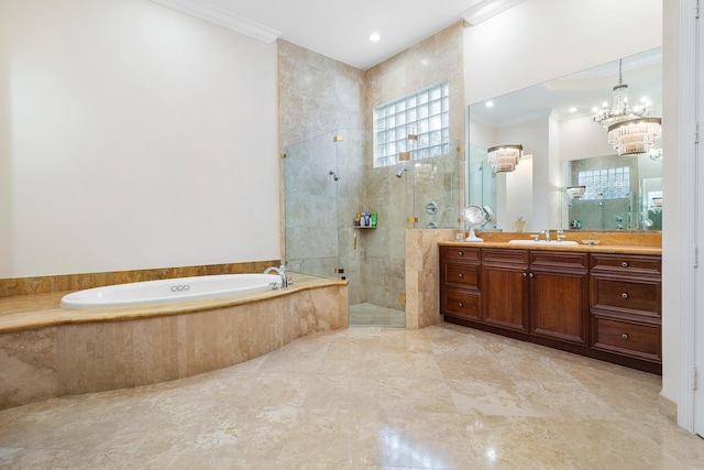 bathroom featuring ornamental molding, a notable chandelier, plus walk in shower, and vanity