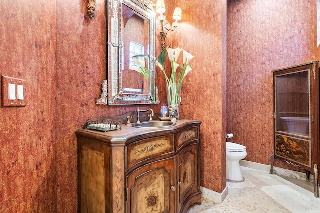 bathroom with toilet and vanity