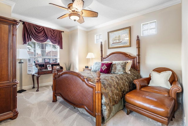 bedroom with ceiling fan, light carpet, and crown molding