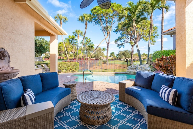 view of patio / terrace with an outdoor hangout area and a fenced in pool