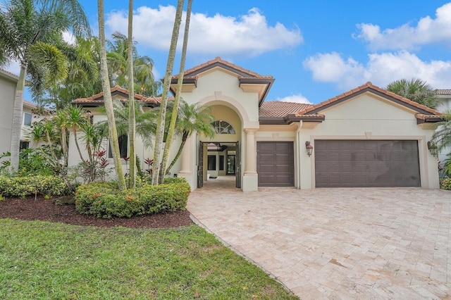 mediterranean / spanish-style house featuring a garage