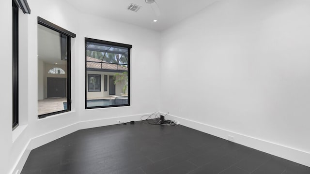 unfurnished room featuring wood-type flooring