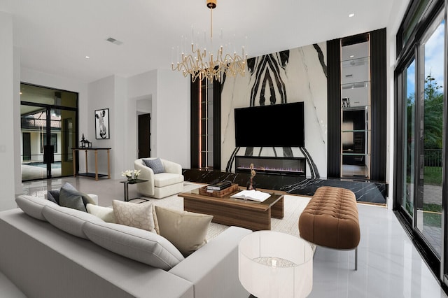 living room featuring floor to ceiling windows and a chandelier