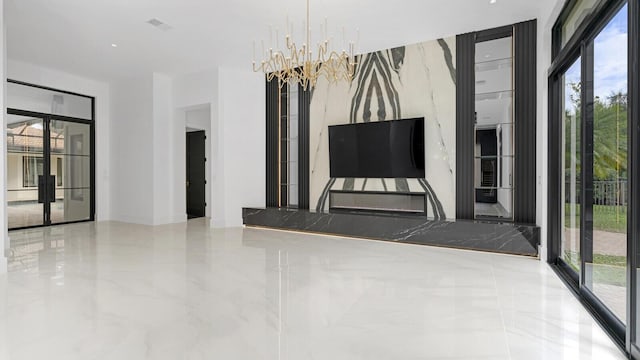 unfurnished living room with an inviting chandelier