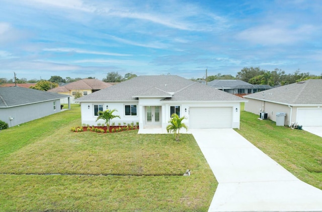 single story home with a garage, central AC, and a front yard