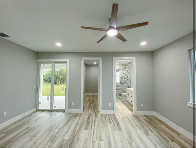 empty room featuring ceiling fan and light hardwood / wood-style flooring