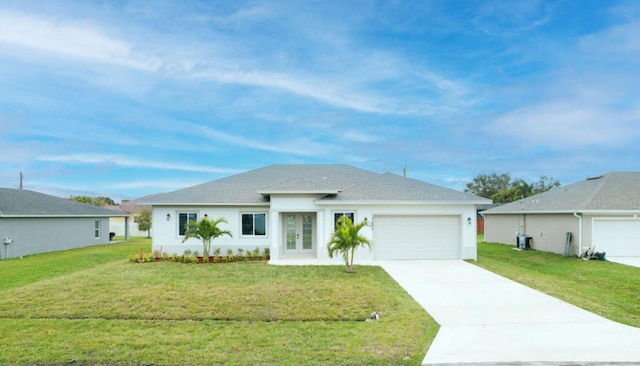 view of front of house featuring a garage and a front yard