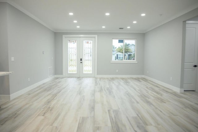 interior space with ornamental molding, light hardwood / wood-style floors, and french doors