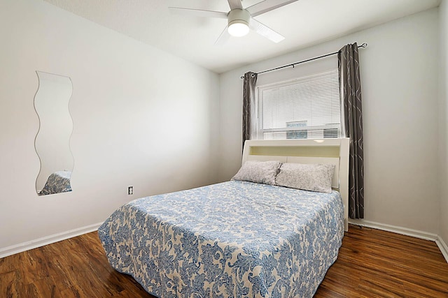 bedroom featuring ceiling fan, wood finished floors, and baseboards