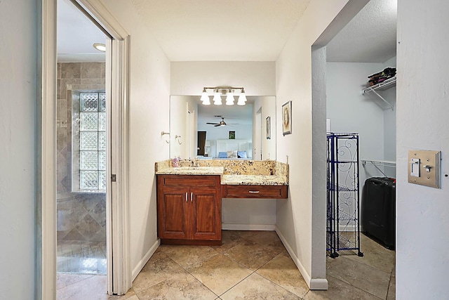 bathroom featuring baseboards and vanity