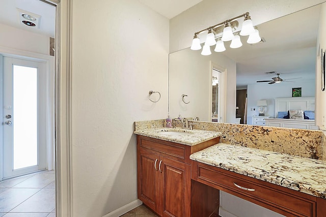 bathroom featuring visible vents, a ceiling fan, vanity, tile patterned flooring, and baseboards