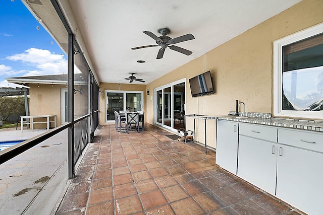 view of patio featuring a sink, a ceiling fan, and area for grilling