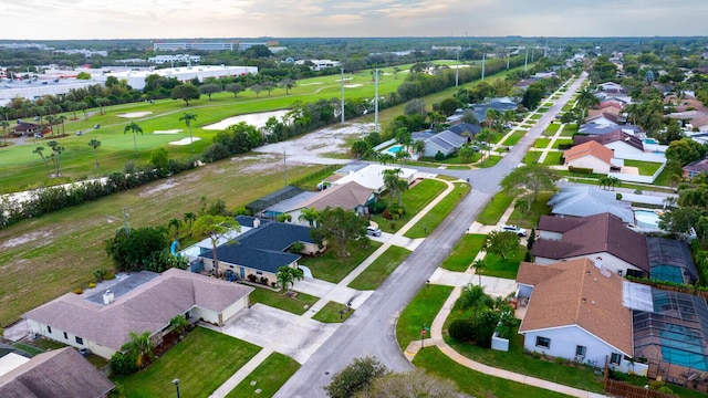 aerial view featuring a residential view and golf course view