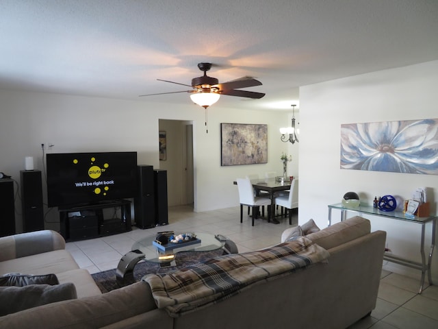 tiled living room featuring ceiling fan and a textured ceiling