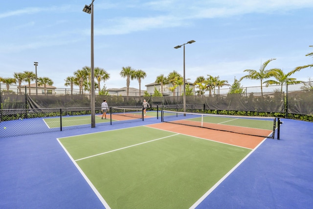 view of tennis court featuring basketball court