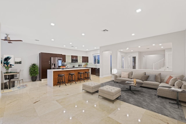 living room featuring ceiling fan