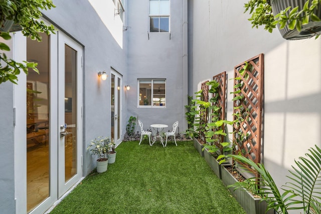 view of yard with french doors