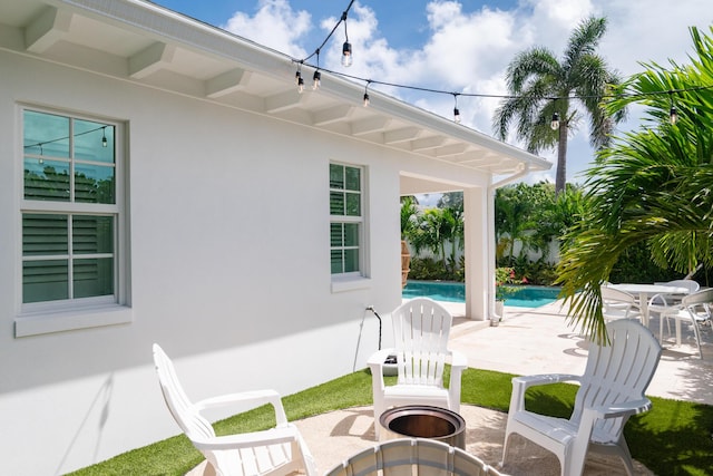 view of patio featuring a fire pit