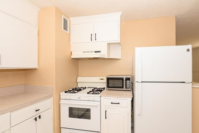 kitchen with white cabinetry, white appliances, and ventilation hood