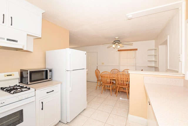 kitchen with white appliances, extractor fan, ceiling fan, white cabinetry, and light tile patterned flooring