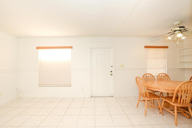 tiled dining area with ceiling fan