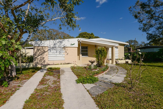 bungalow with a front lawn