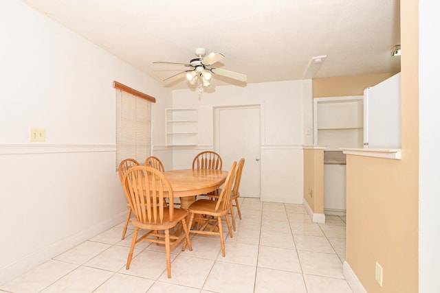 dining area featuring ceiling fan and light tile patterned flooring