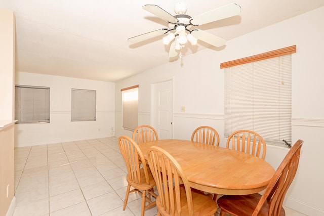 dining area featuring ceiling fan and light tile patterned floors