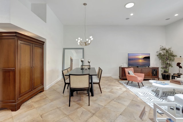 dining space with an inviting chandelier