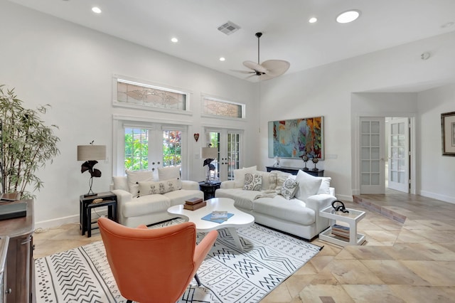 living room with ceiling fan and french doors