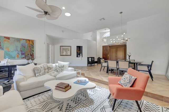 tiled living room with ceiling fan with notable chandelier and high vaulted ceiling