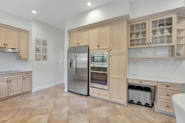 kitchen with decorative backsplash and appliances with stainless steel finishes