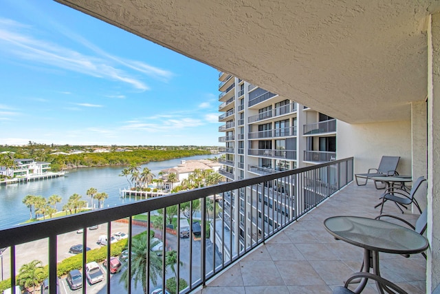 balcony featuring a water view