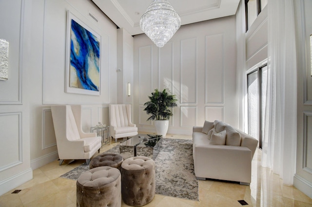 sitting room featuring a chandelier