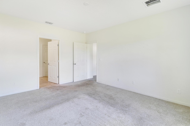 unfurnished bedroom featuring light colored carpet