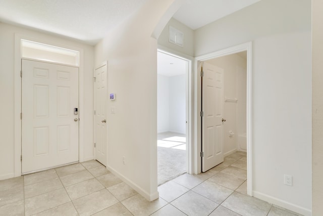 entryway featuring light tile patterned flooring