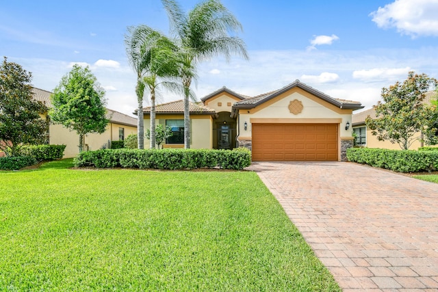 view of front of property with a garage and a front yard