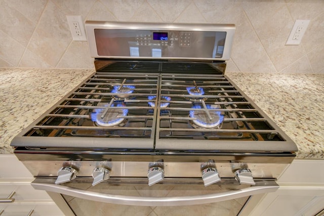 details featuring stainless steel range with gas stovetop