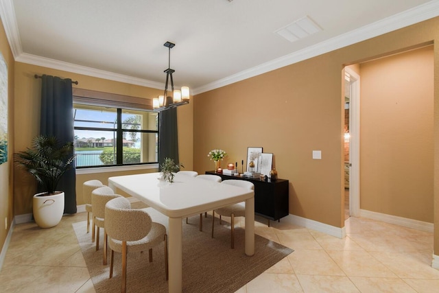 tiled dining space with ornamental molding and a chandelier