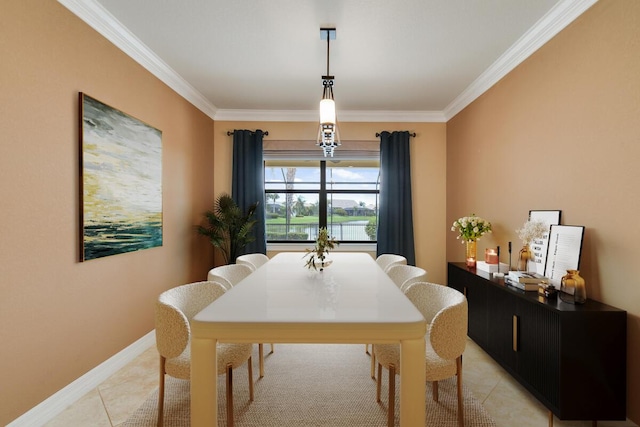 dining area featuring light tile patterned floors and crown molding